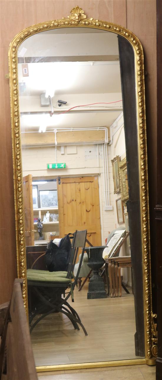 An early 20th century arched gilt wall mirror W.95cm
